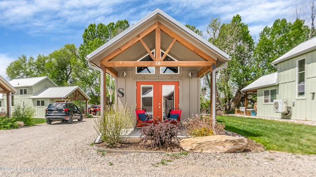 329 River Frontage Rd # 14, Silt, CO 81652 - view of outbuilding with gravel driveway, french doors, and ac unit