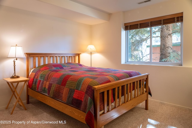 bedroom featuring carpet floors, baseboards, and visible vents