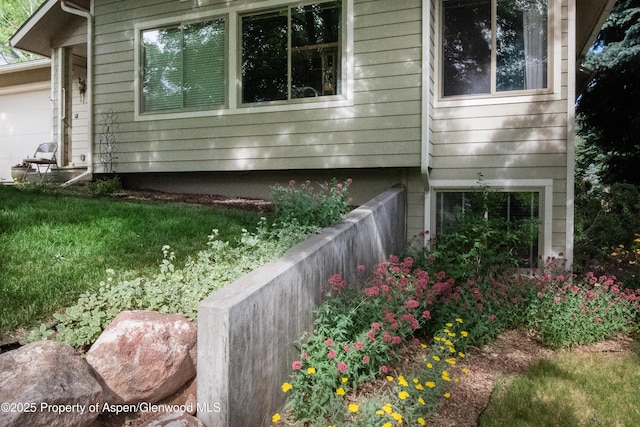 view of side of property with an attached garage