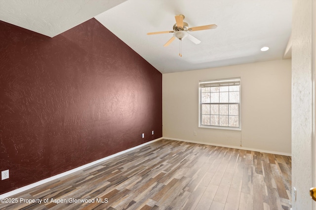 721 Pine Ct, New Castle, CO 81647 - unfurnished room with baseboards, wood finished floors, and a ceiling fan