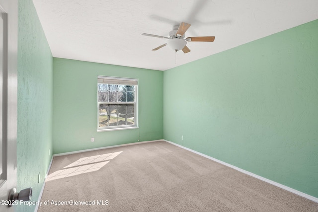 721 Pine Ct, New Castle, CO 81647 - spare room featuring baseboards, ceiling fan, and carpet floors