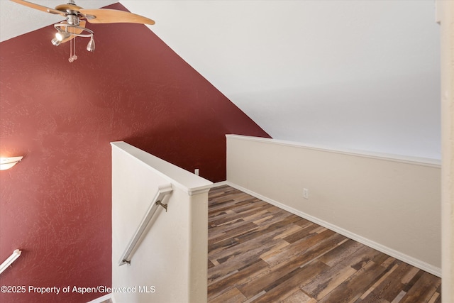 721 Pine Ct, New Castle, CO 81647 - stairway with baseboards, lofted ceiling, ceiling fan, and wood finished floors