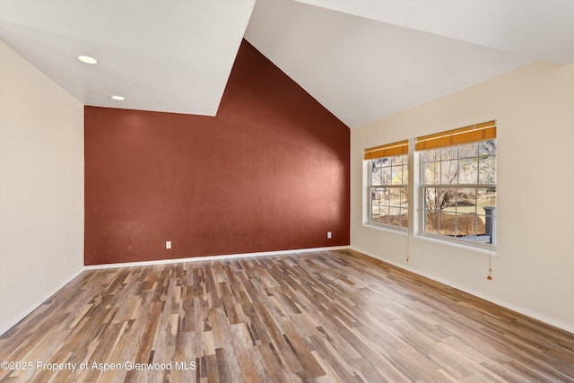 721 Pine Ct, New Castle, CO 81647 - empty room with baseboards, vaulted ceiling, wood finished floors, and recessed lighting