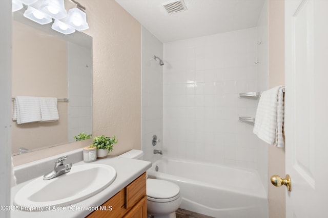 721 Pine Ct, New Castle, CO 81647 - bathroom with visible vents, toilet, vanity, bathing tub / shower combination, and a textured wall