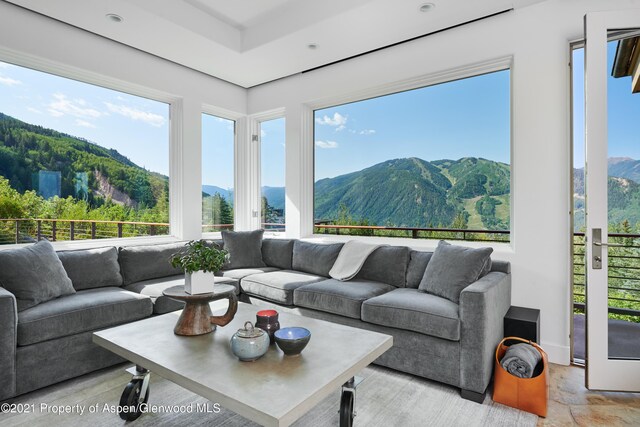 sunroom / solarium with a mountain view