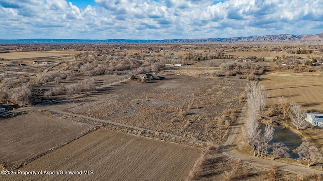 aerial view featuring a mountain view and a rural view