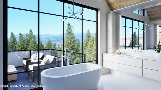 bathroom with vanity, vaulted ceiling, tile patterned floors, wood ceiling, and a bathtub