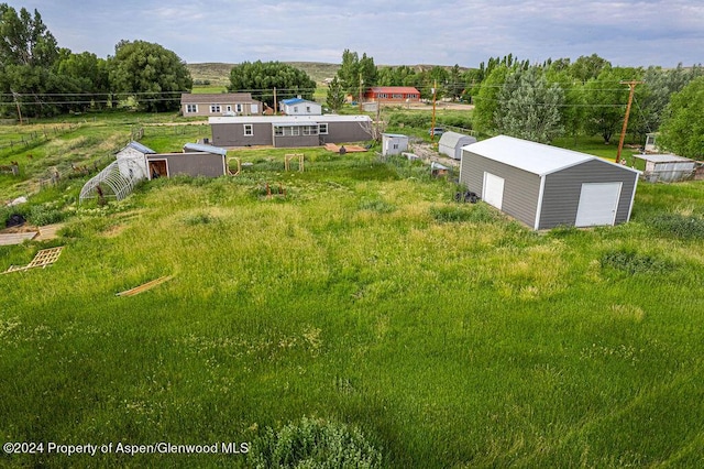 261 Ellis Ave, Maybell, CO 81640 - view of yard featuring an outbuilding and a detached garage