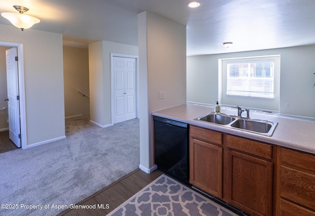 2449 Pine Ln, Rifle, CO 81650 - kitchen with dishwasher, a sink, light countertops, brown cabinets, and recessed lighting