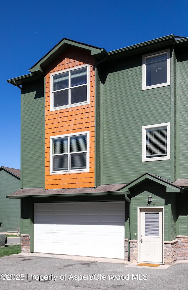 2449 Pine Ln, Rifle, CO 81650 - view of front facade featuring an attached garage