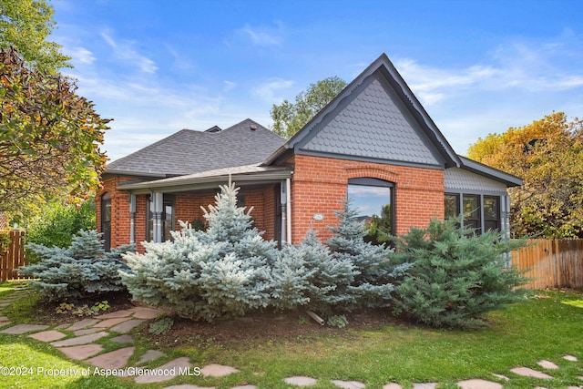 view of home's exterior with a yard