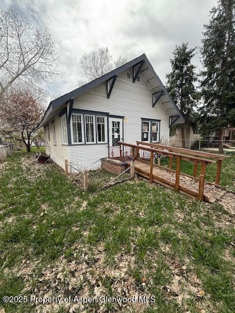 545 Taylor St, Craig, CO 81625 - view of snow covered exterior featuring a chimney and fence