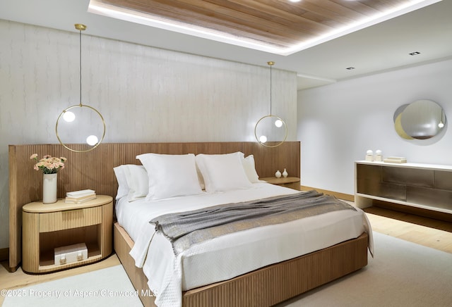 bedroom featuring wooden ceiling and wood finished floors