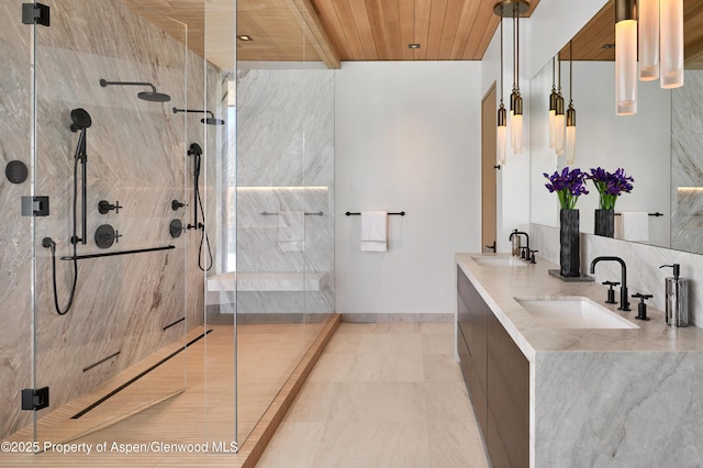 bathroom featuring baseboards, wooden ceiling, a sink, and a shower stall