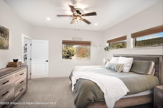 bedroom featuring ceiling fan, recessed lighting, baseboards, and light carpet