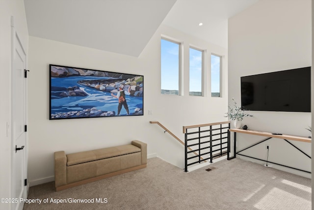 living area with recessed lighting, visible vents, and carpet flooring