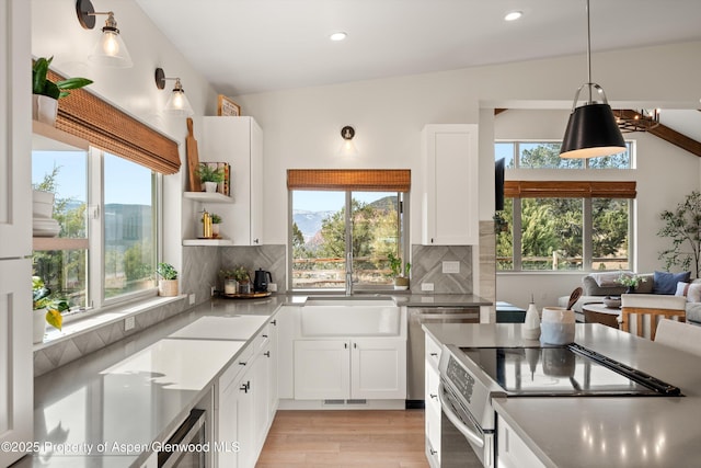 kitchen featuring white cabinets, backsplash, visible vents, and appliances with stainless steel finishes