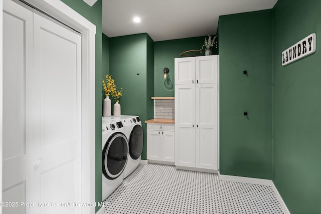 clothes washing area with baseboards, light floors, recessed lighting, cabinet space, and separate washer and dryer