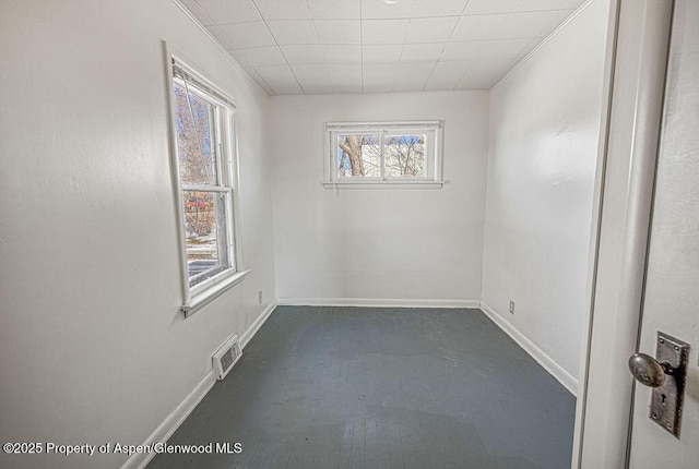 spare room with visible vents and baseboards