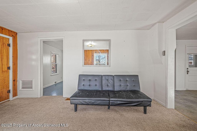 sitting room with carpet and visible vents