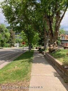 1114 Blake Ave, Glenwood Springs, CO 81601 - view of asphalt road with sidewalks and traffic signs