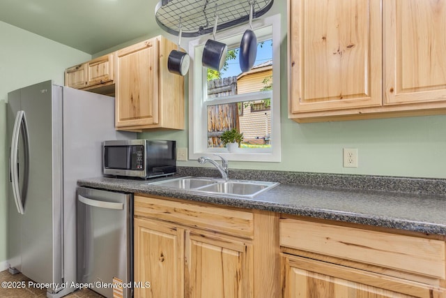 1114 Blake Ave, Glenwood Springs, CO 81601 - kitchen featuring appliances with stainless steel finishes, light brown cabinets, and dark countertops