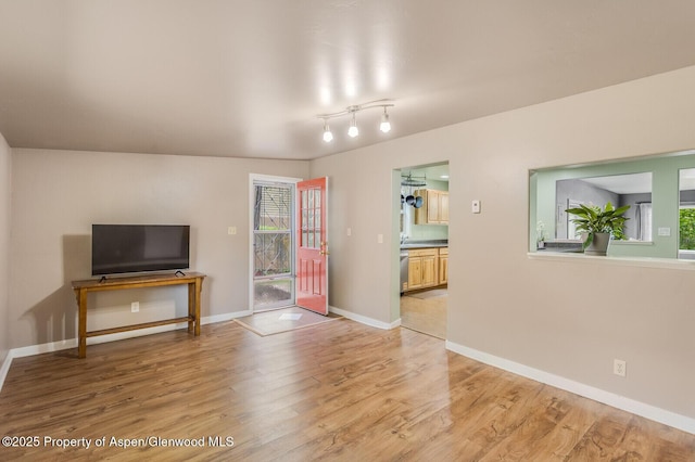 1114 Blake Ave, Glenwood Springs, CO 81601 - unfurnished living room featuring plenty of natural light and light wood finished floors
