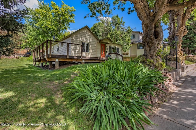1114 Blake Ave, Glenwood Springs, CO 81601 - view of front facade featuring a front yard and a wooden deck