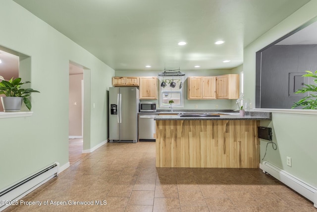 1114 Blake Ave, Glenwood Springs, CO 81601 - kitchen with appliances with stainless steel finishes, a baseboard radiator, light brown cabinets, a peninsula, and recessed lighting