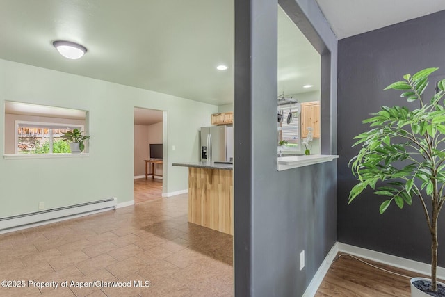 1114 Blake Ave, Glenwood Springs, CO 81601 - kitchen with stainless steel fridge with ice dispenser, a baseboard heating unit, light brown cabinets, light countertops, and recessed lighting