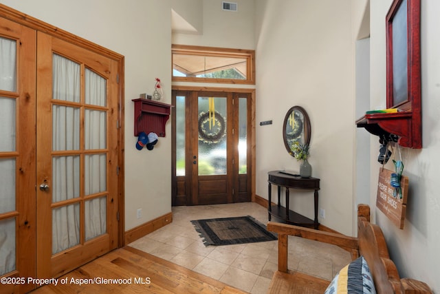 123 Corral Dr, Carbondale, CO 81623 - entrance foyer featuring a high ceiling, baseboards, wood finished floors, and visible vents