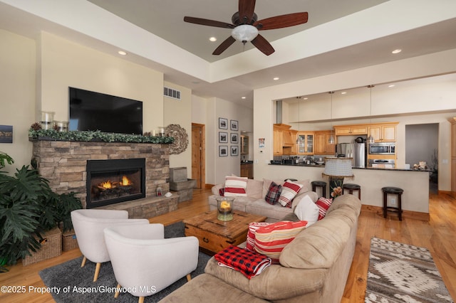 123 Corral Dr, Carbondale, CO 81623 - living area featuring light wood-style flooring, visible vents, recessed lighting, a ceiling fan, and a fireplace