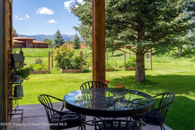 123 Corral Dr, Carbondale, CO 81623 - view of patio / terrace with outdoor dining space, a garden, and a mountain view