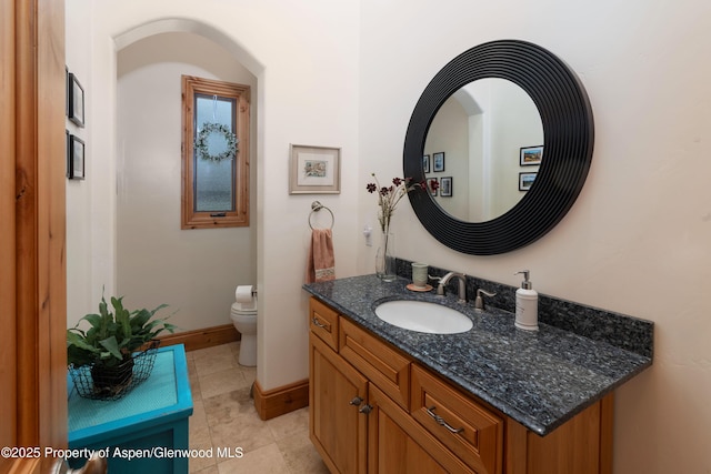 123 Corral Dr, Carbondale, CO 81623 - bathroom with tile patterned flooring, baseboards, toilet, and vanity