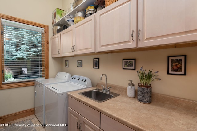 123 Corral Dr, Carbondale, CO 81623 - laundry area with independent washer and dryer, a sink, and cabinet space