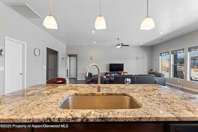 1326 Fairway Dr, Fruita, CO 81521 - kitchen featuring open floor plan, hanging light fixtures, a sink, and visible vents