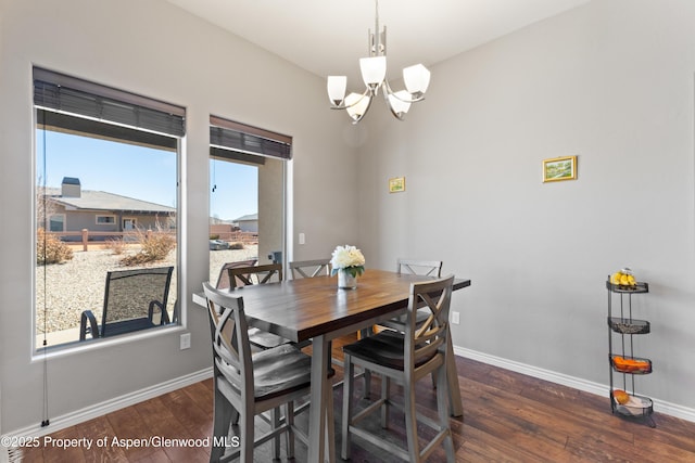 1326 Fairway Dr, Fruita, CO 81521 - dining area with hardwood / wood-style floors, an inviting chandelier, and baseboards