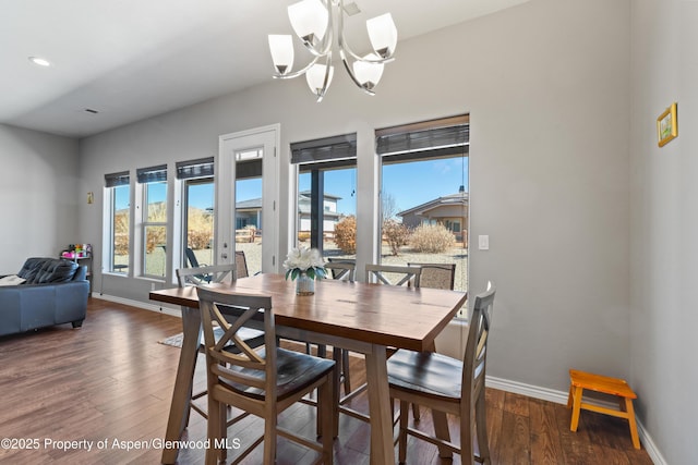 1326 Fairway Dr, Fruita, CO 81521 - dining space featuring a chandelier, wood-type flooring, and baseboards
