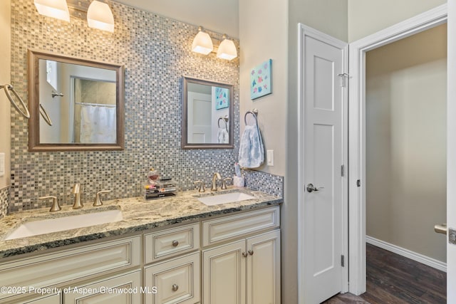 1326 Fairway Dr, Fruita, CO 81521 - full bath featuring tasteful backsplash, double vanity, a sink, and wood finished floors