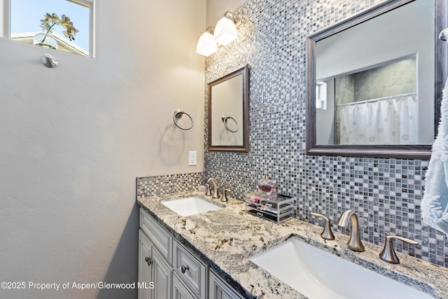 1326 Fairway Dr, Fruita, CO 81521 - full bath with double vanity, curtained shower, backsplash, and a sink