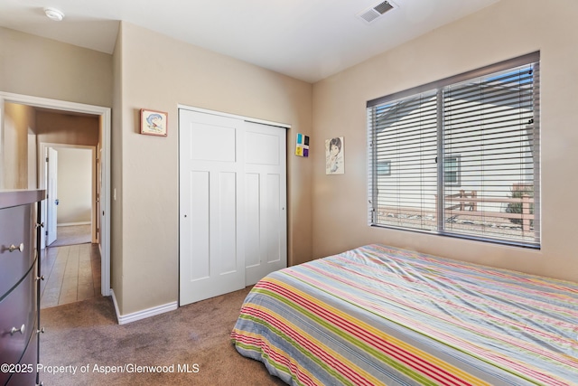 1326 Fairway Dr, Fruita, CO 81521 - bedroom with carpet, a closet, visible vents, and baseboards