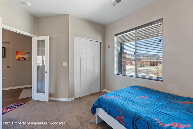 1326 Fairway Dr, Fruita, CO 81521 - bedroom with carpet floors, visible vents, baseboards, french doors, and a closet
