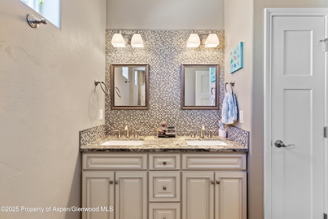1326 Fairway Dr, Fruita, CO 81521 - full bathroom featuring double vanity, a sink, and decorative backsplash