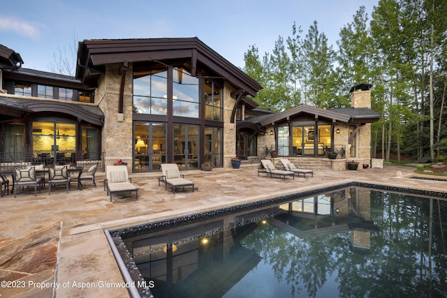 rear view of house featuring a patio