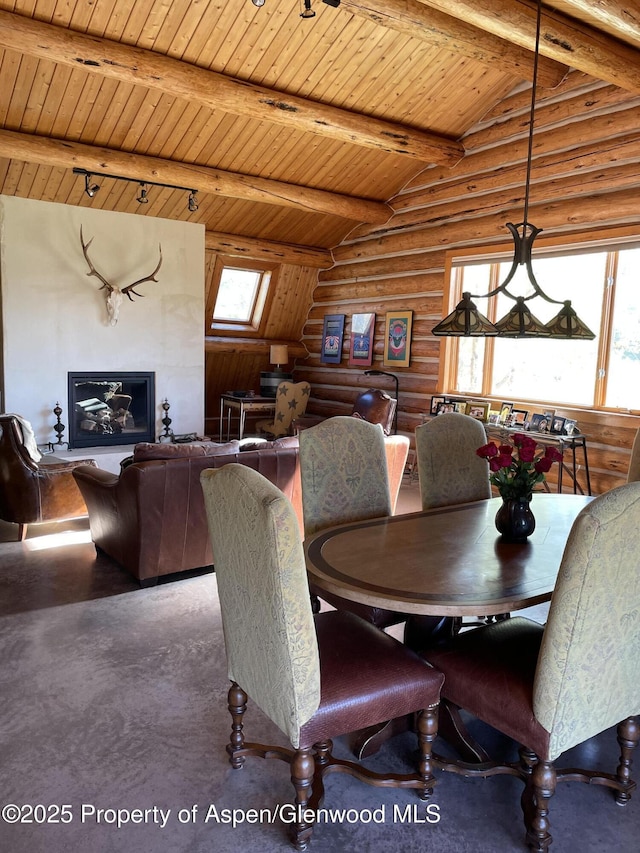 14255 County Road 730, Gunnison, CO 81230 - dining room featuring rustic walls, wooden ceiling, and a skylight