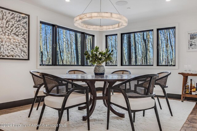 dining space with light wood-type flooring