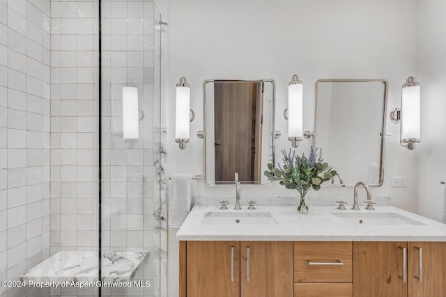 bathroom featuring vanity and an enclosed shower