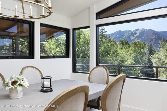 interior space with a notable chandelier and a mountain view
