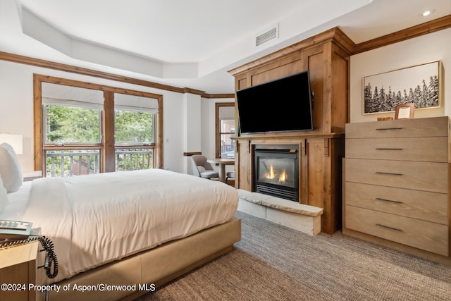 415 E Dean St Unit 32, Aspen, CO 81611 - carpeted bedroom featuring a glass covered fireplace, a tray ceiling, crown molding, and recessed lighting
