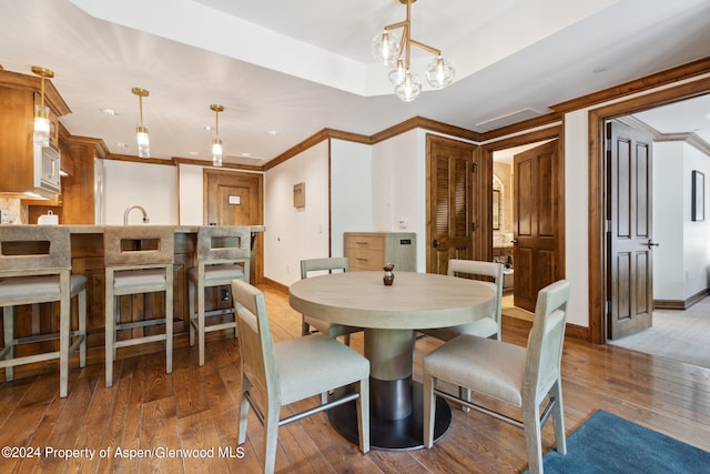 415 E Dean St Unit 32, Aspen, CO 81611 - dining space with hardwood / wood-style floors, ornamental molding, and baseboards